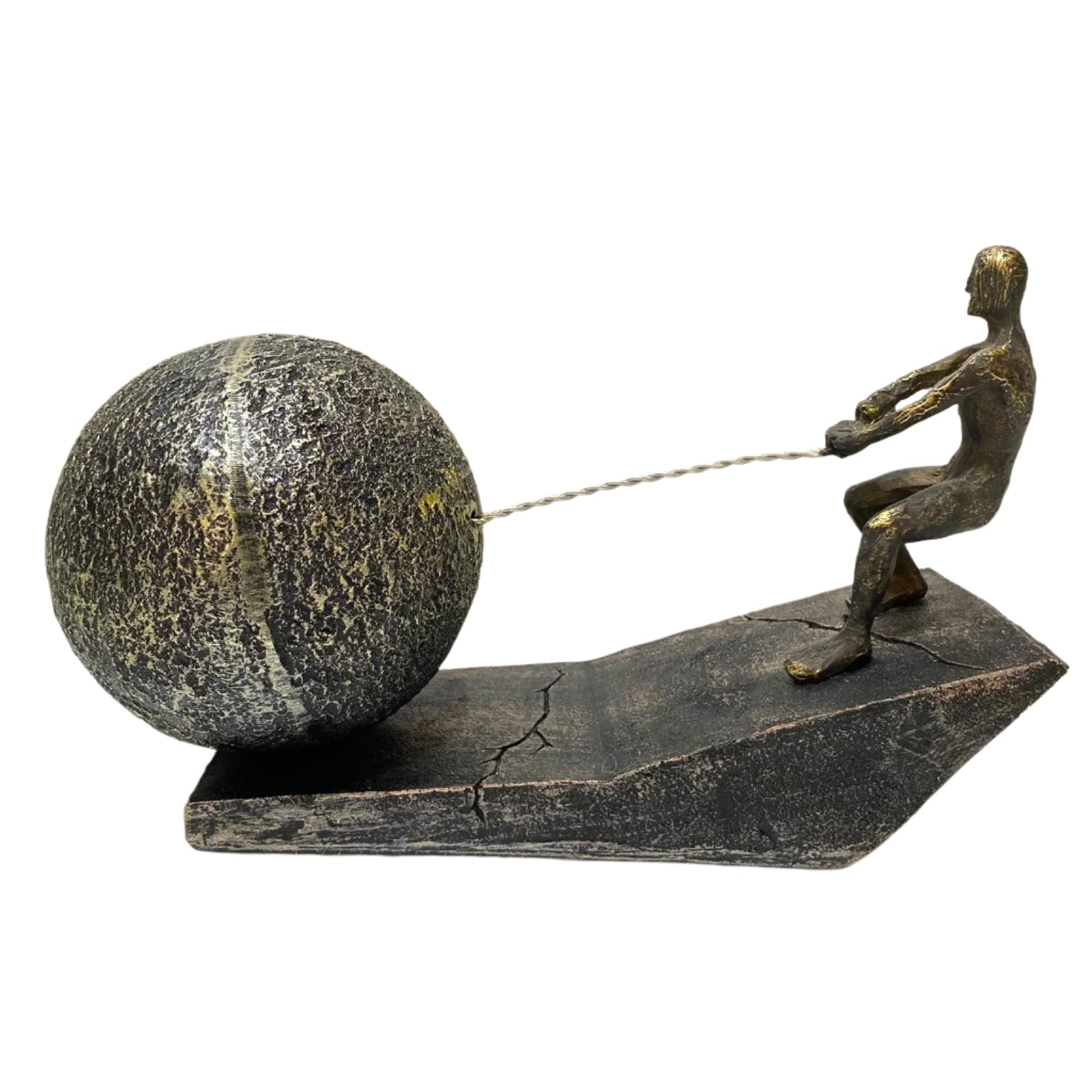 Bronze sculpture of a figure pulling a large ball on a white background
