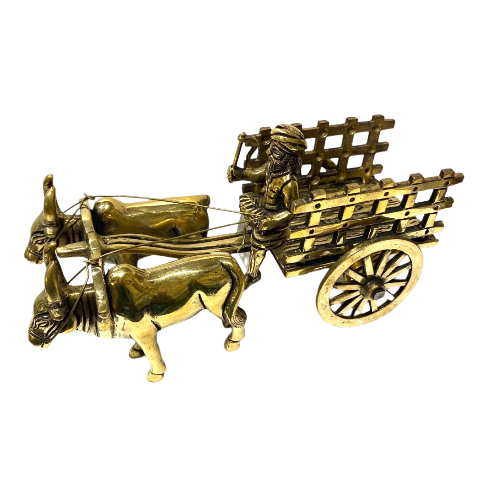 Bronze model of a bull pulling a cart with a driver on a white background