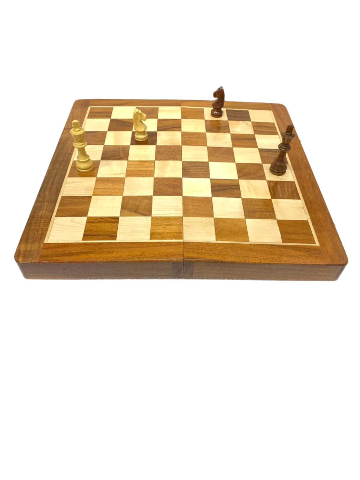 Wooden chessboard with pieces on a white surface