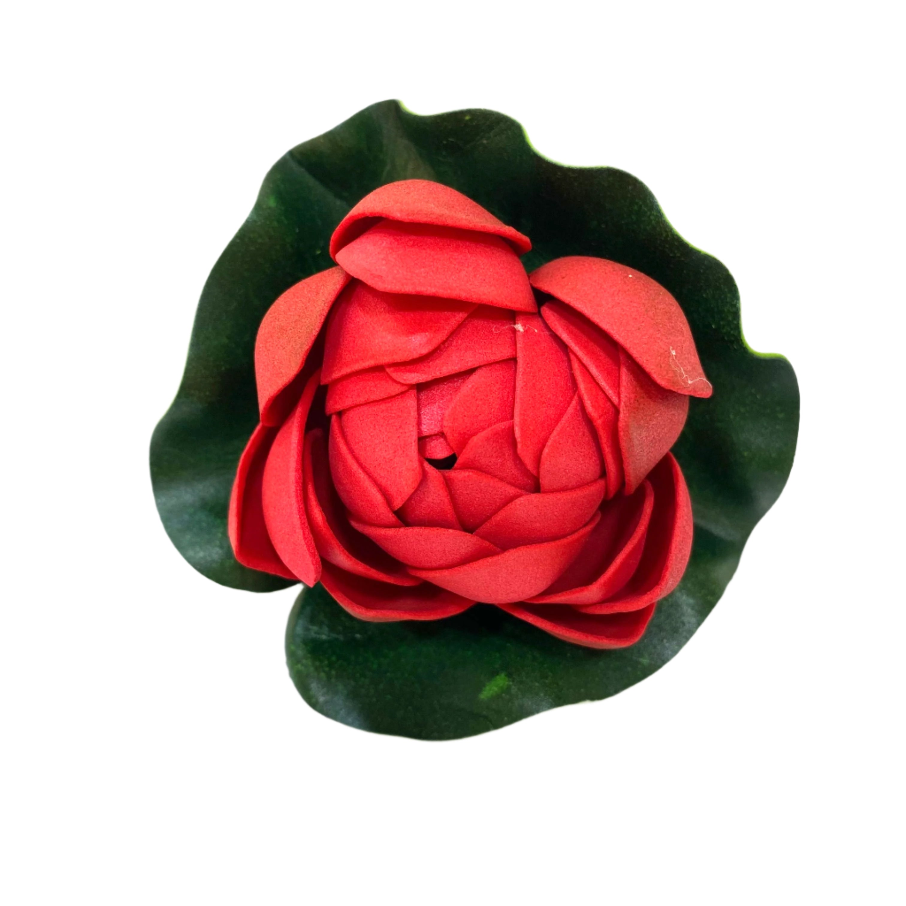 Red flower-shaped object on a white background