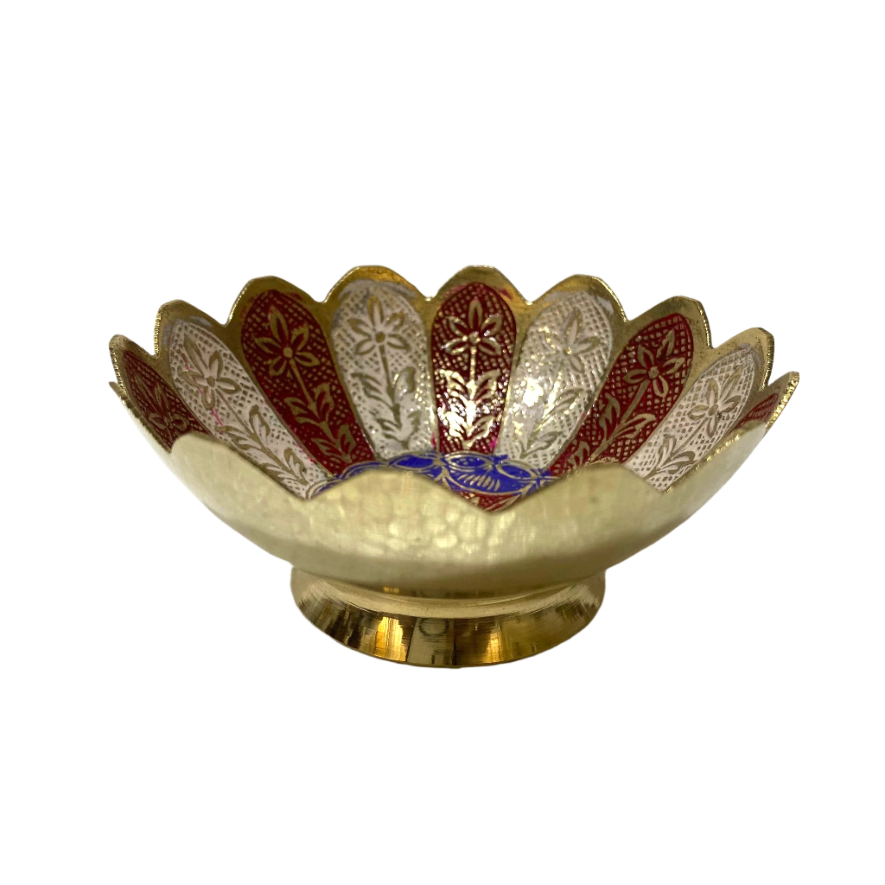 Decorative bowl with intricate patterns on a textured white surface