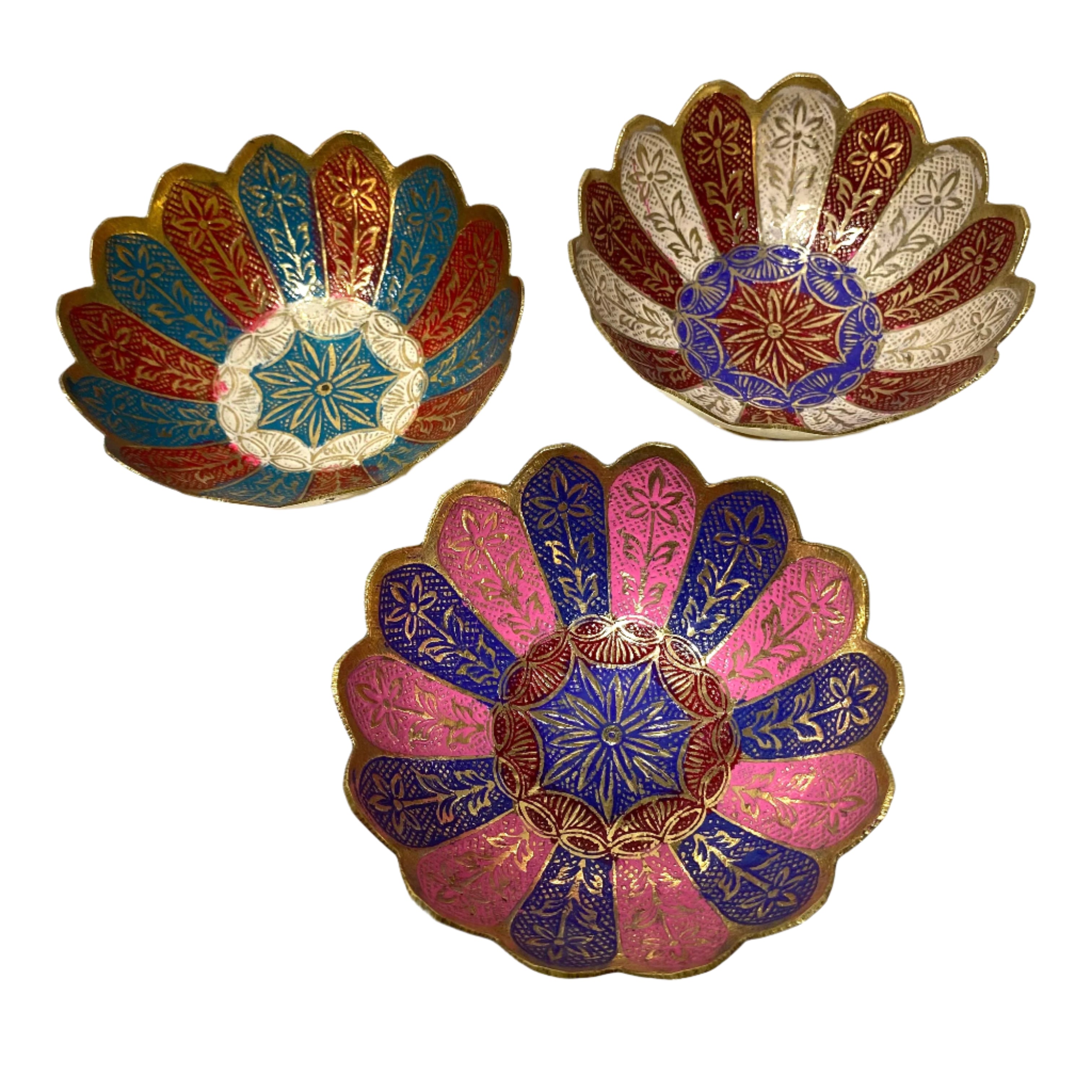 Three decorative bowls with floral patterns on a textured white surface
