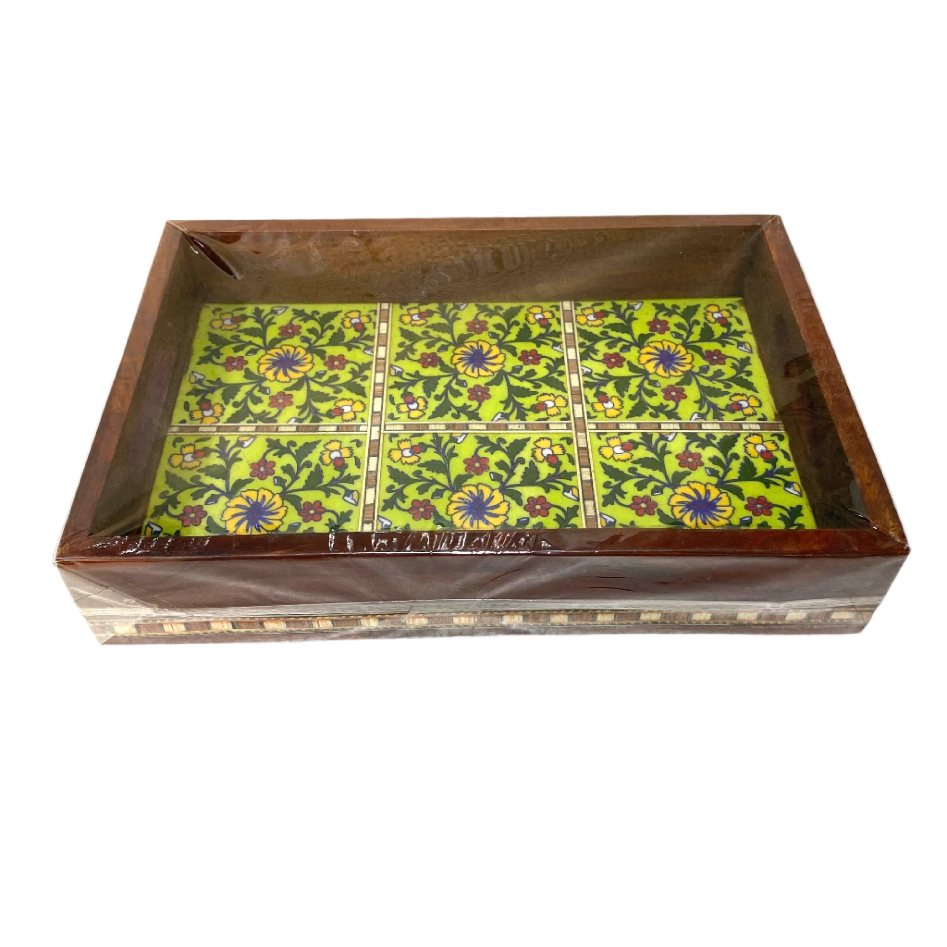 Decorative box with floral pattern on a green background
