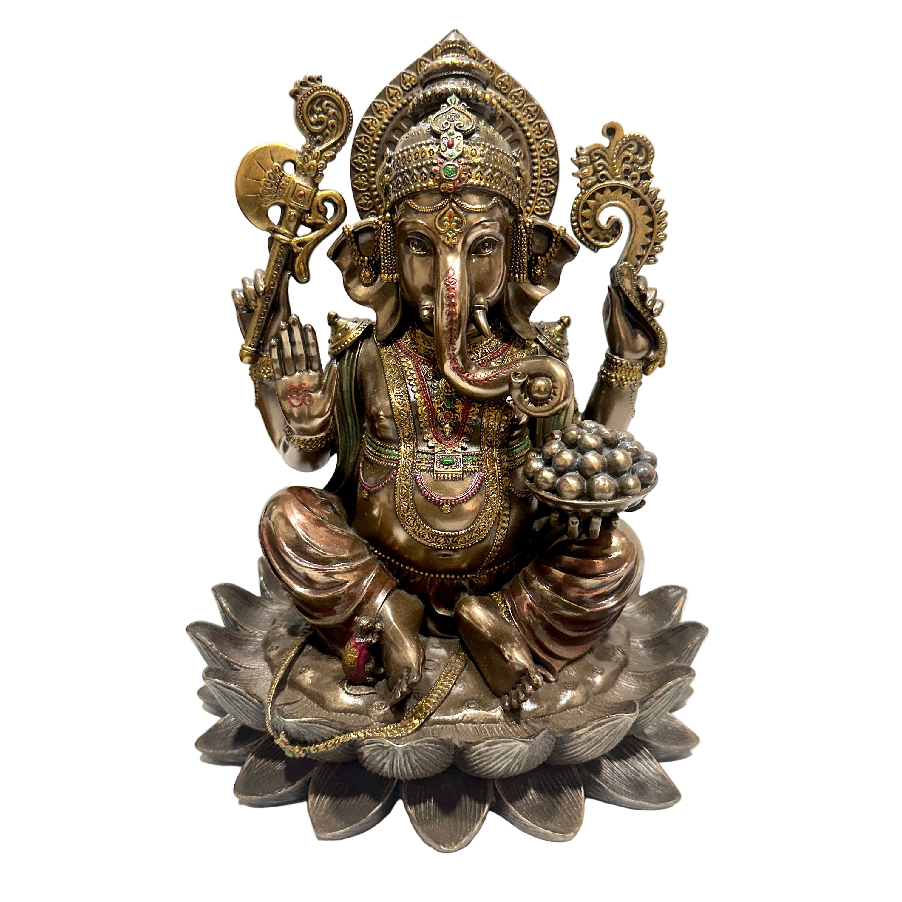 Bronze statue of a deity on a white surface with a mirror in the background