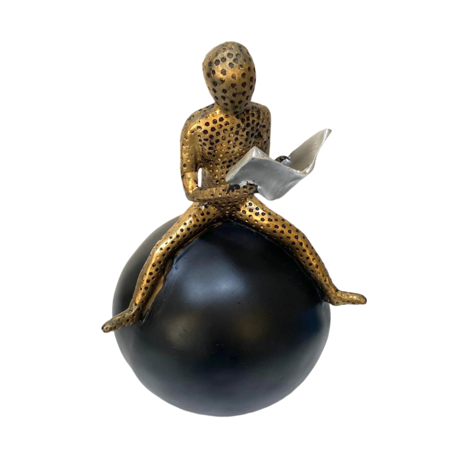 Decorative figurine of a person sitting on a sphere, holding a book, against a light background.