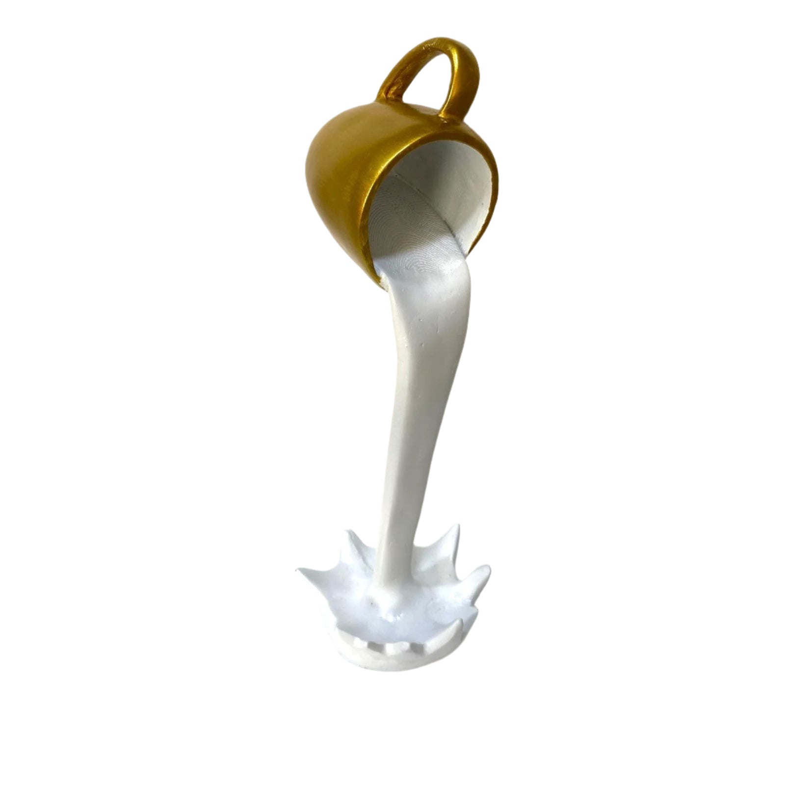 Gold cup pouring white liquid into a white base on a textured white background
