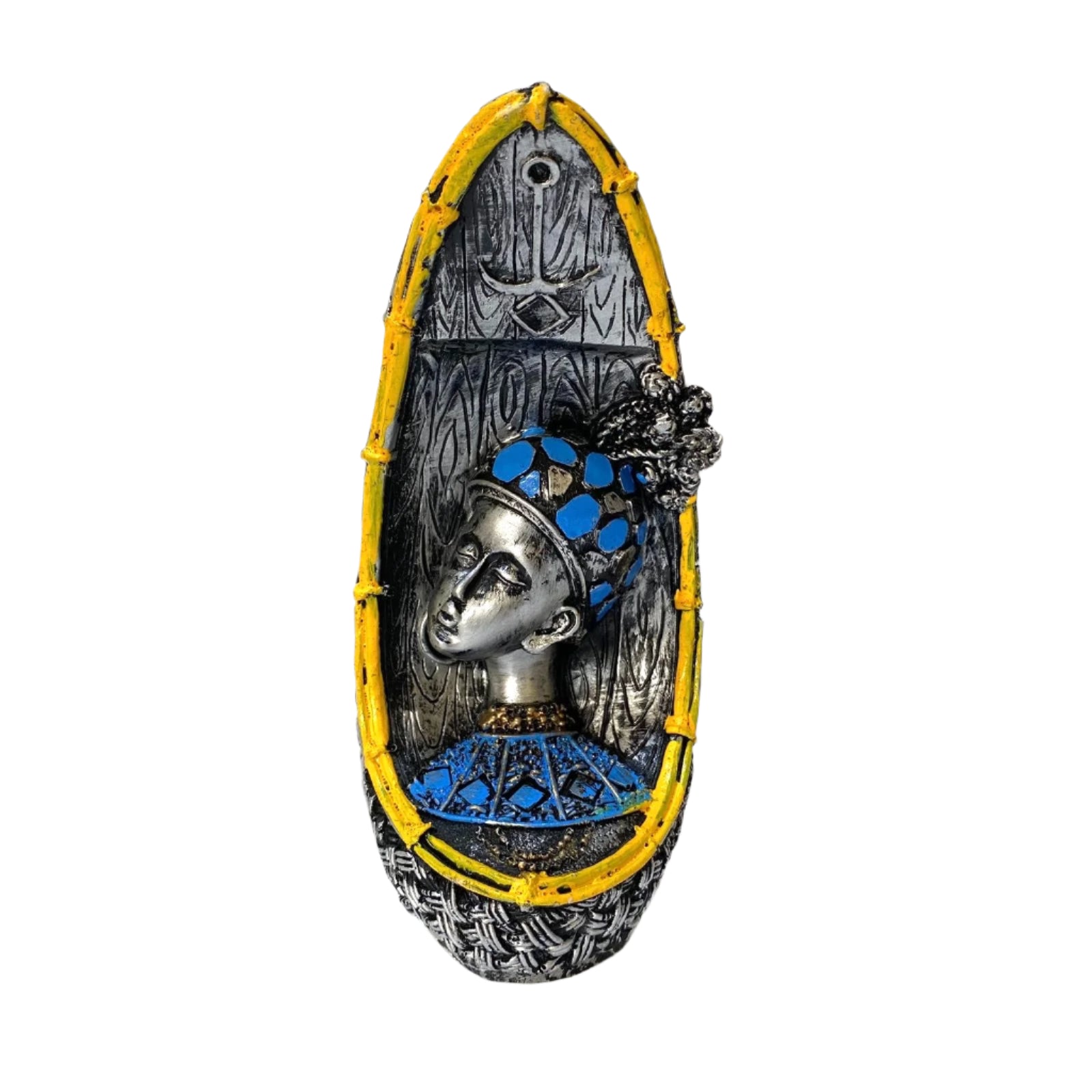 Decorative wall piece with a stylized face design on a textured white background