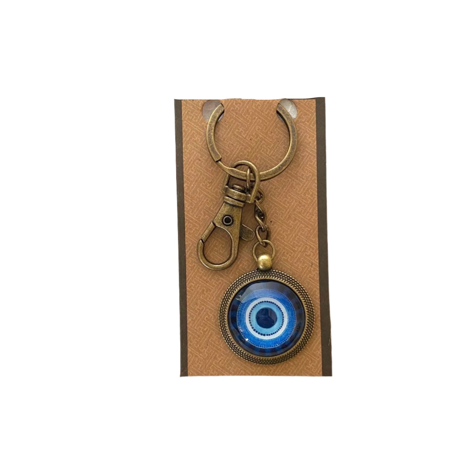 Key ring with blue evil eye design on a cardboard backing