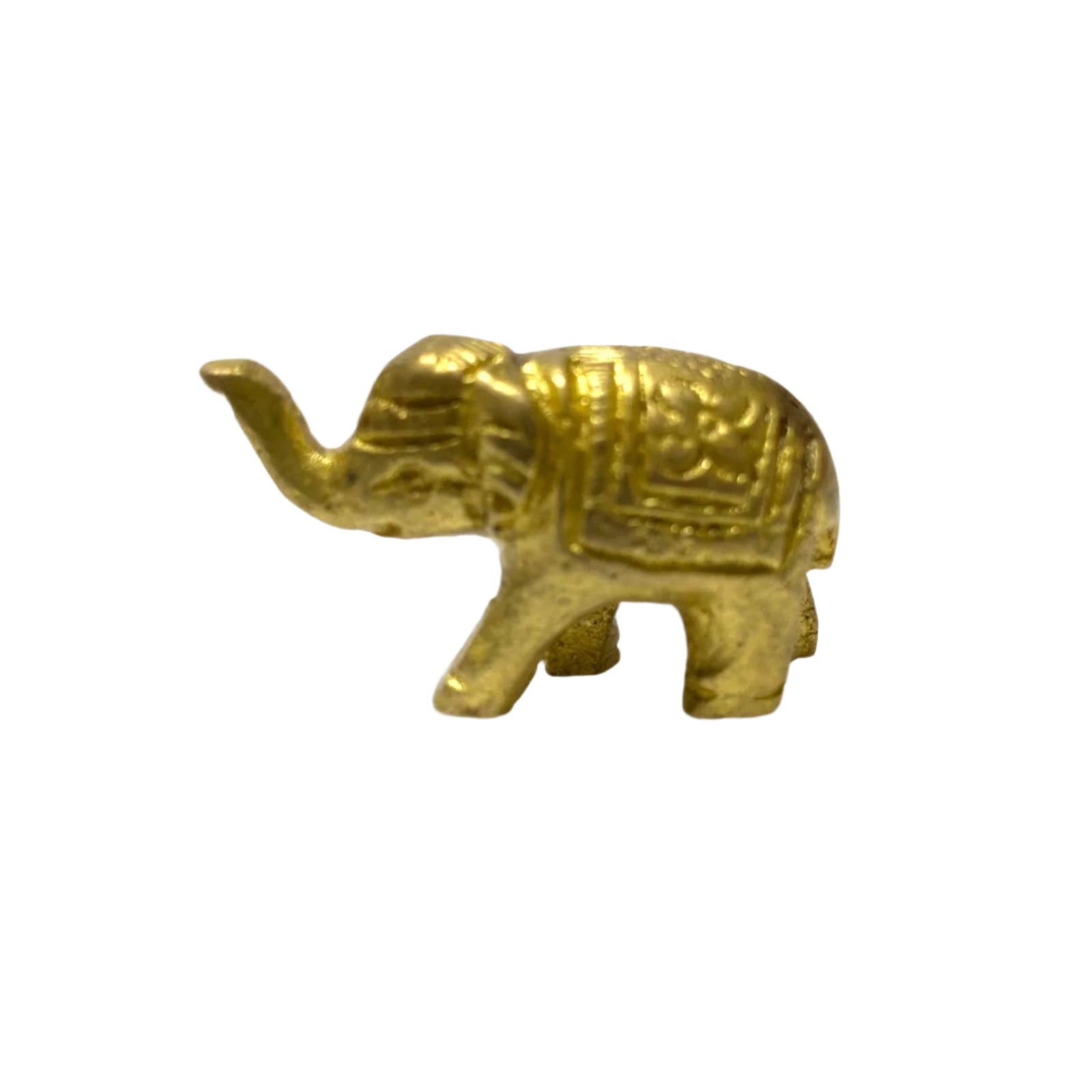Small brass elephant figurine on a white background