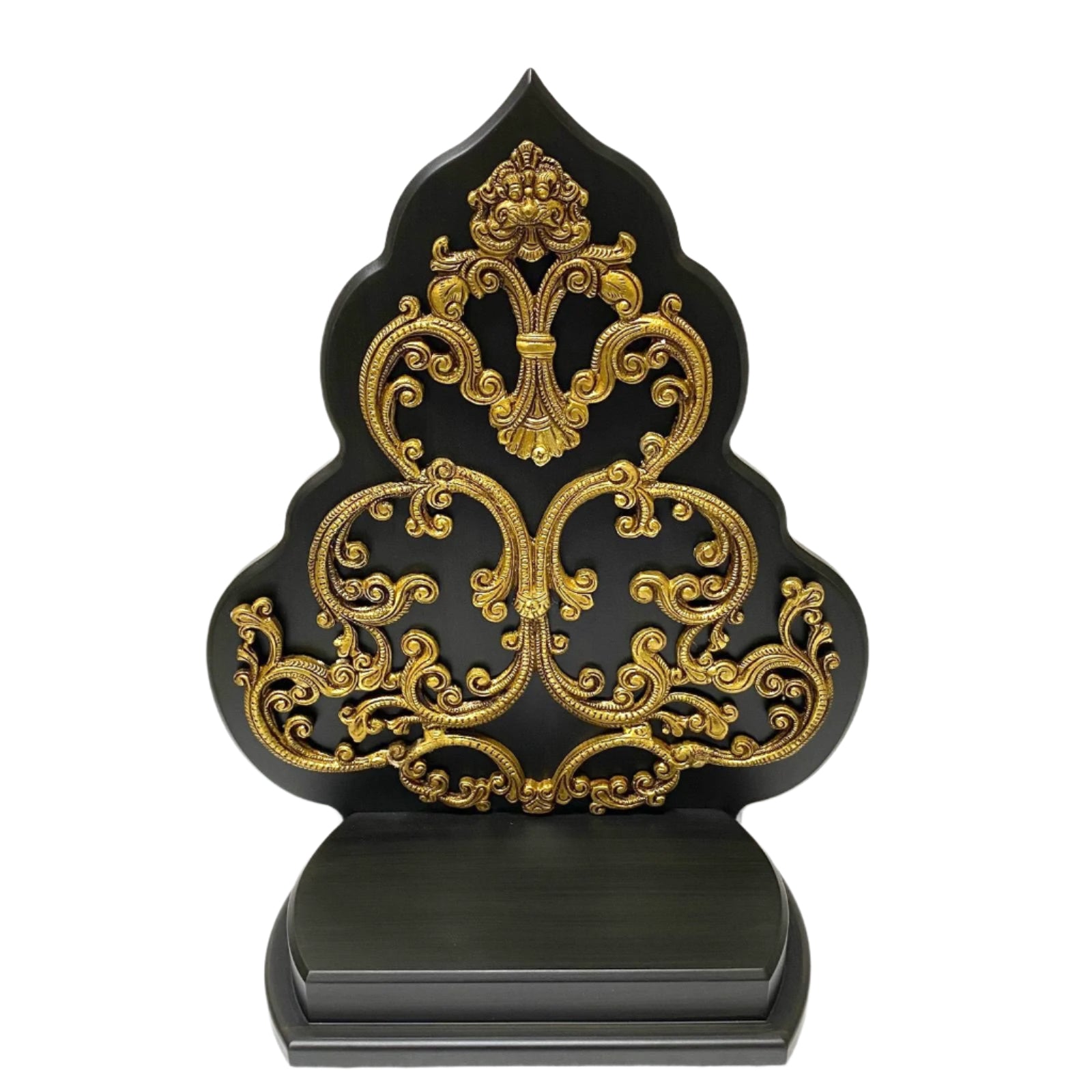 Decorative black and gold ornate object on a white background