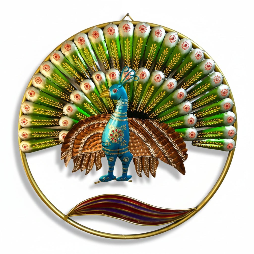A colorful metal wall art piece depicting a peacock with a large fan of green and white wings, a blue body, brown patterned feathers, and a gold circular frame, mounted on a textured off-white wall.