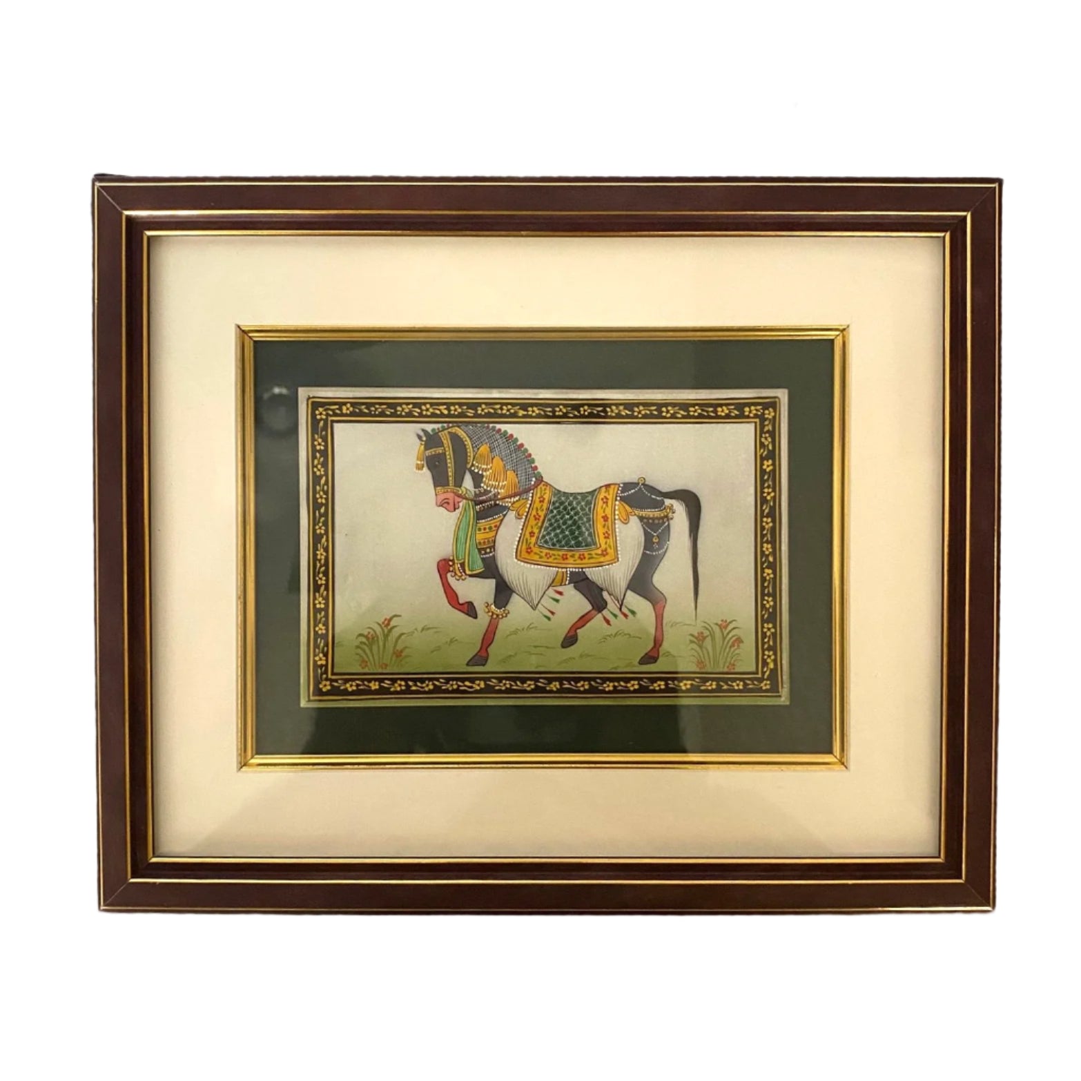 Framed artwork of a horse with decorative elements on a textured wall.