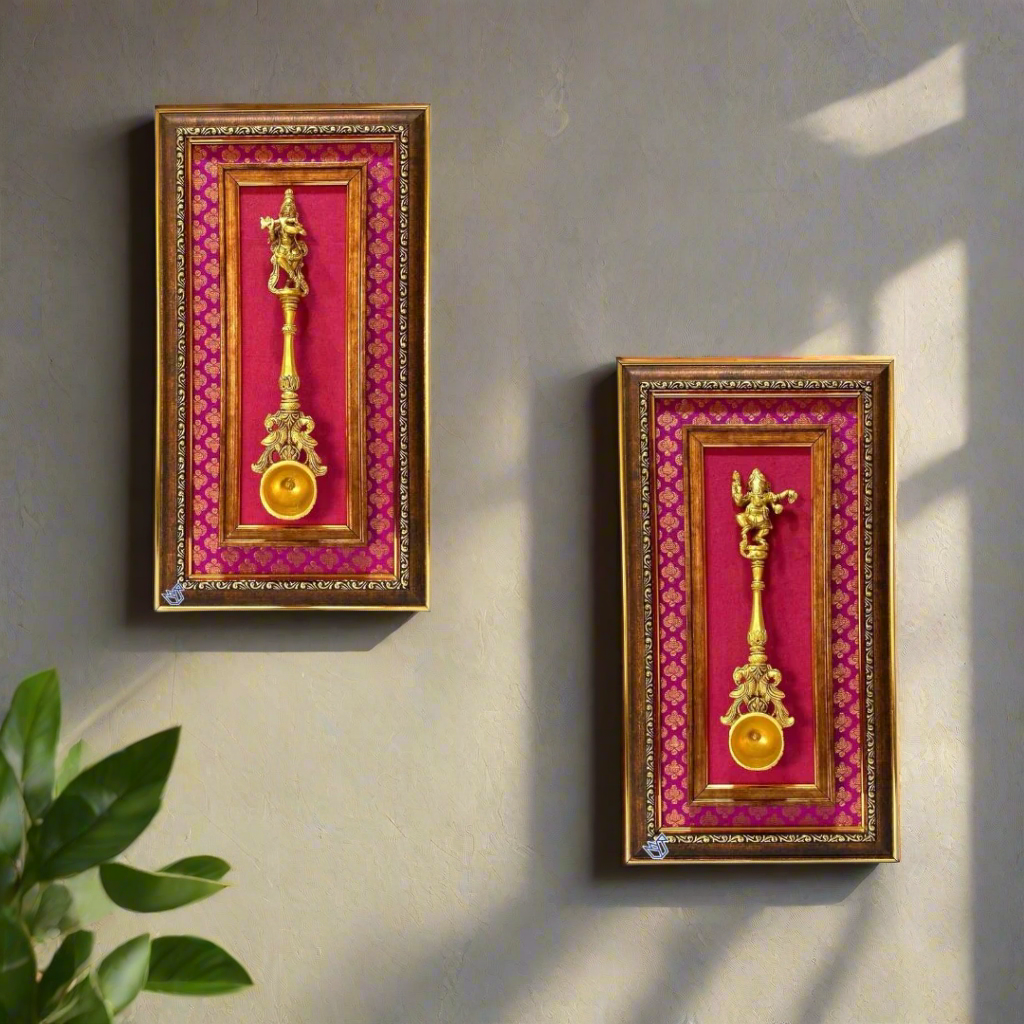 Two decorative wall hangings with gold figurines on a red background, framed in gold.