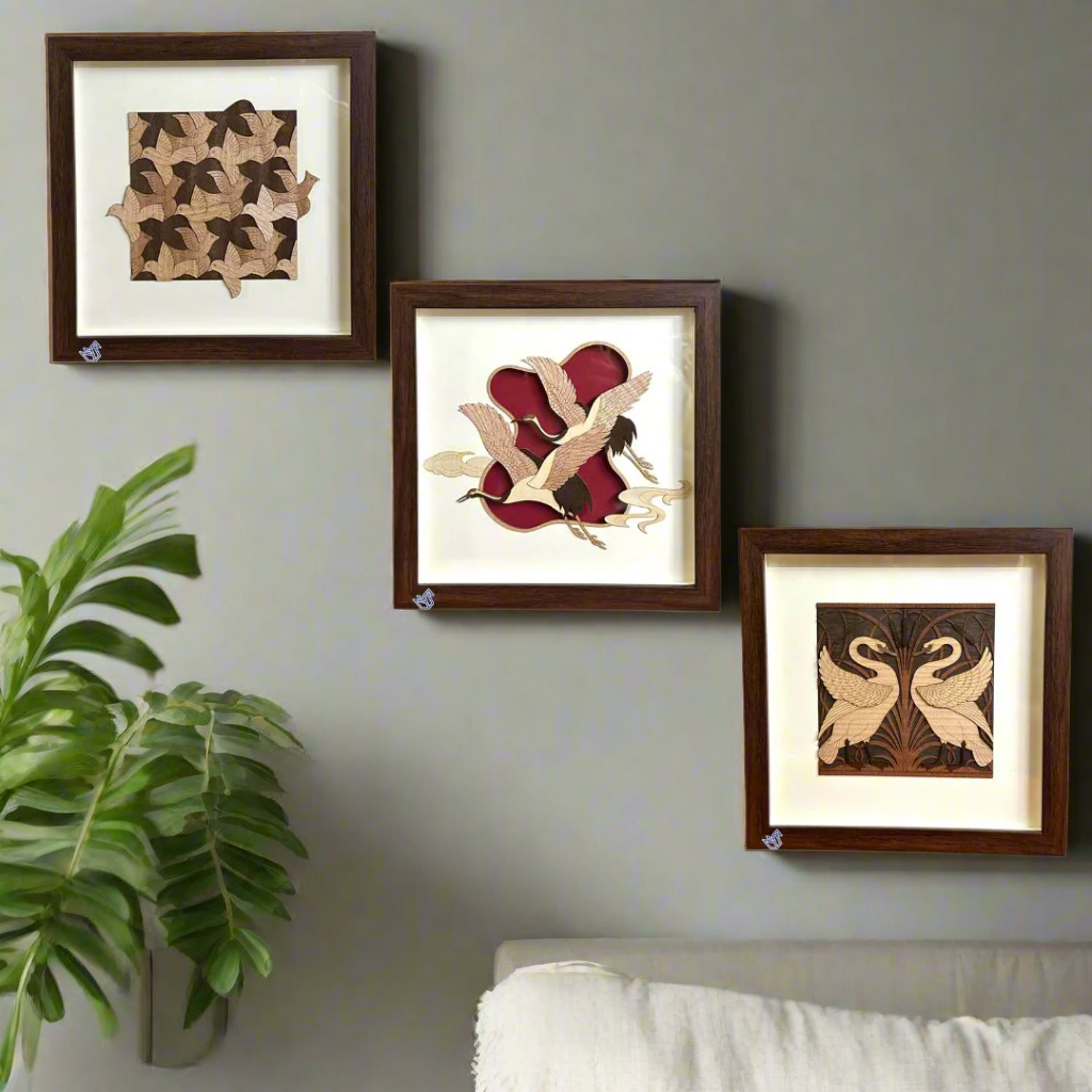 Set of three framed wall art pieces on a white background