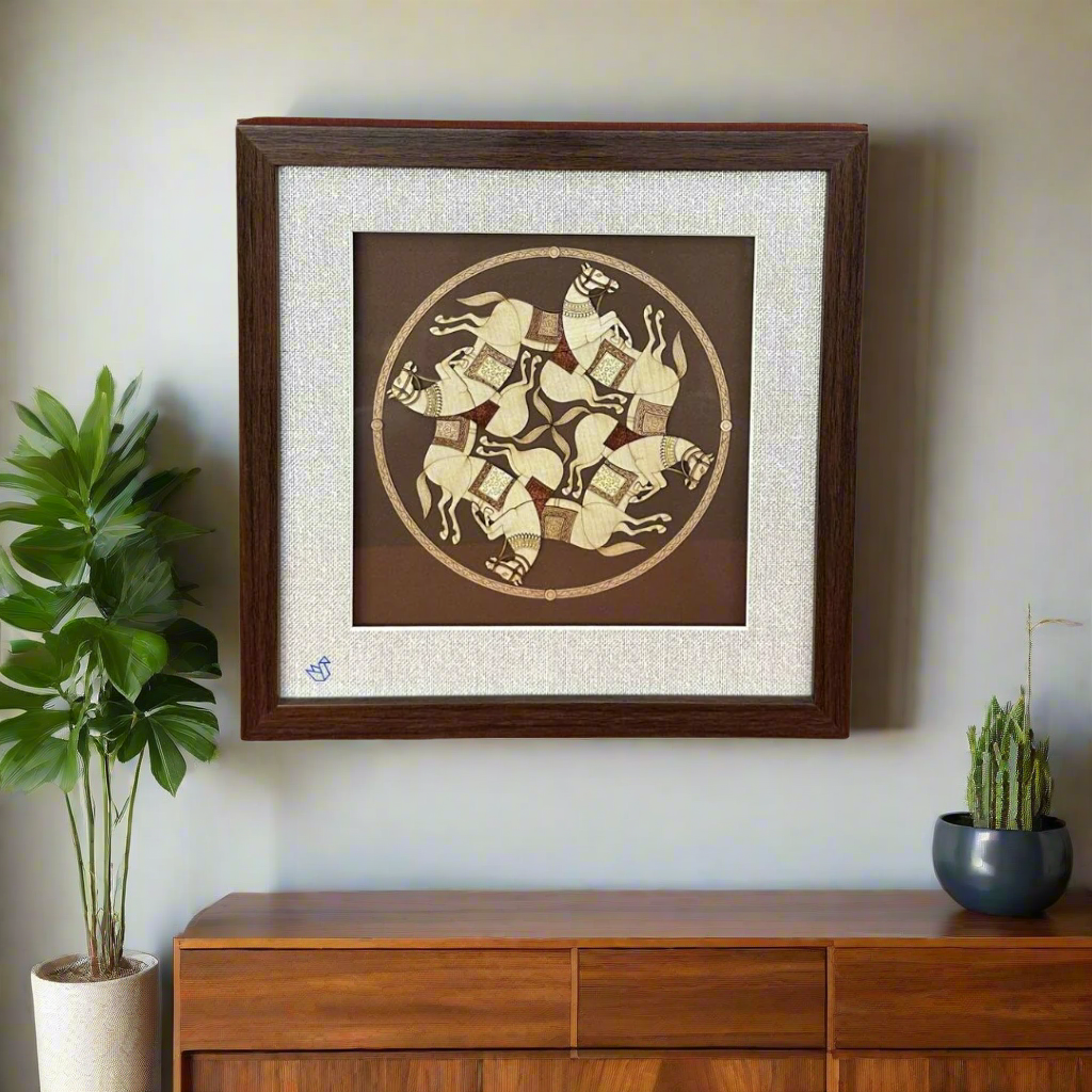 Framed artwork with a circular design of horses on a brown background