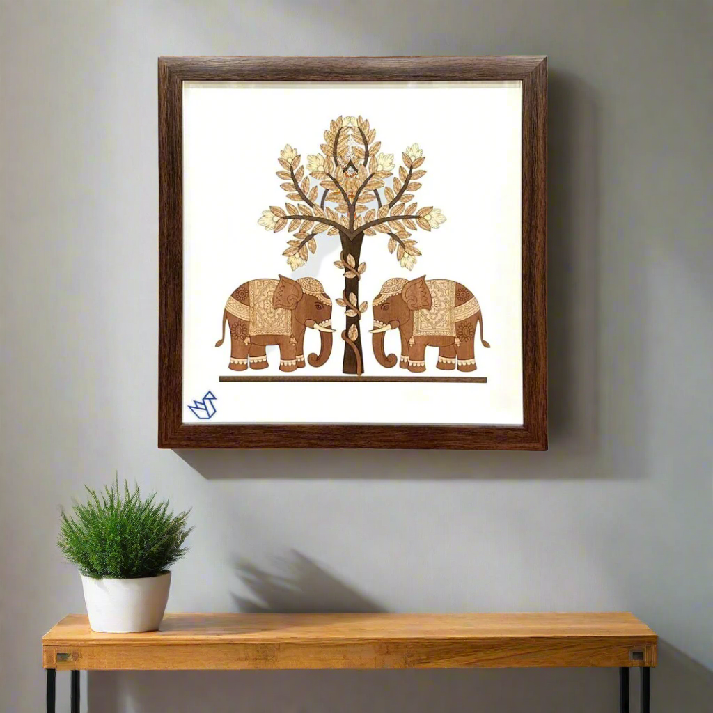 Framed artwork of two elephants and a tree on a white background