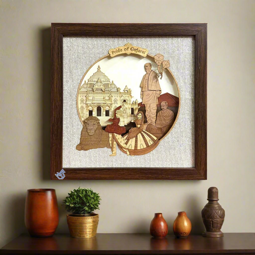 Decorative wall art with a wooden frame featuring a portrait and architectural elements, labeled 'Pride of Gujarat'.