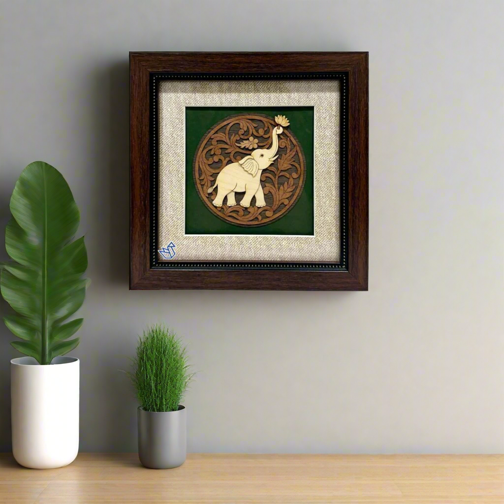Framed artwork with an elephant design on a white background