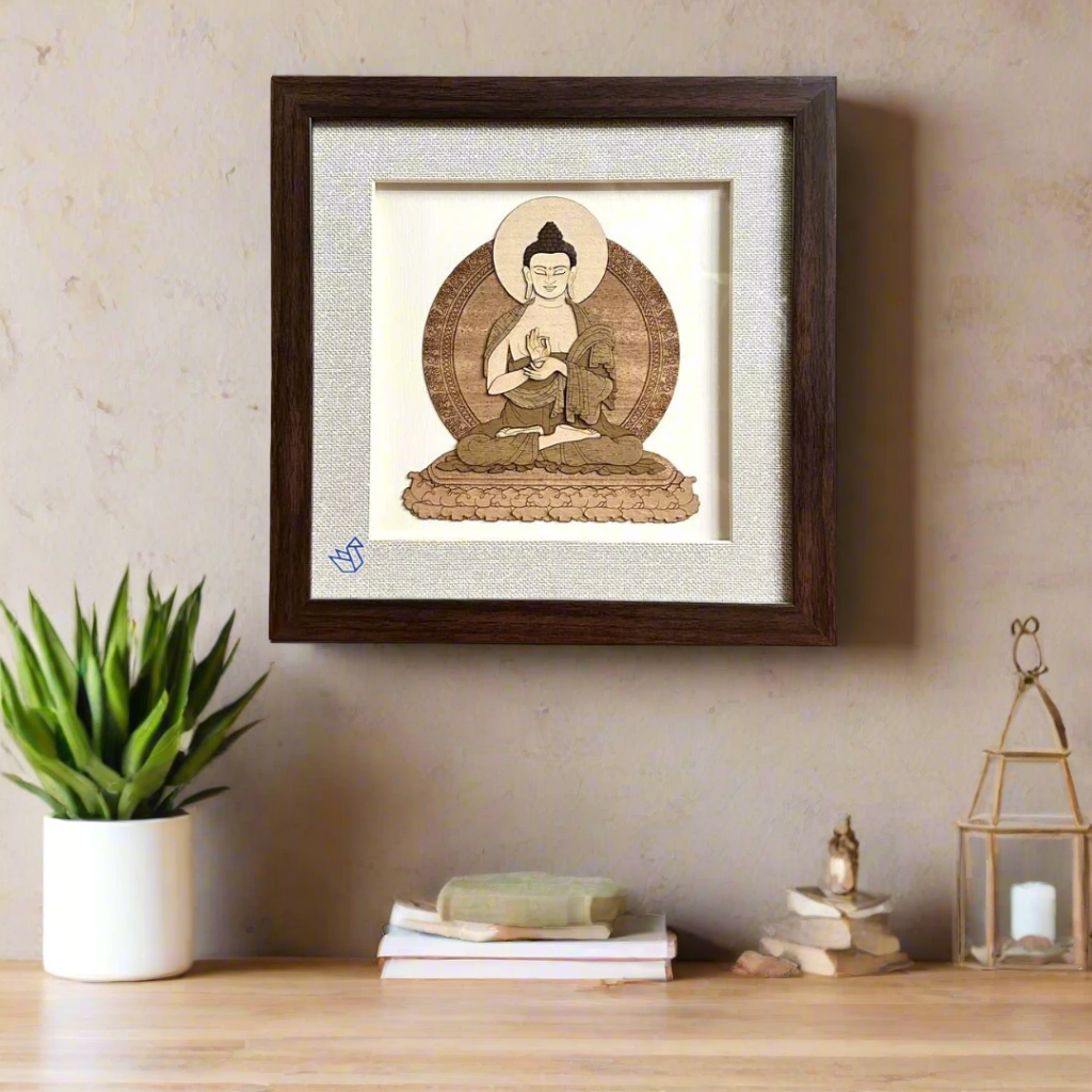 Framed artwork of a Buddha figure on a textured white background
