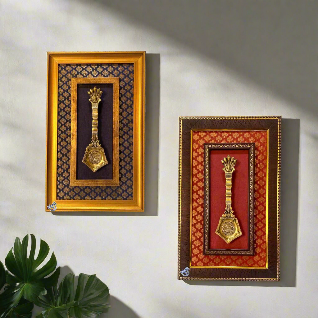 Two decorative wall hangings with gold medallions in ornate wooden frames on a white background.