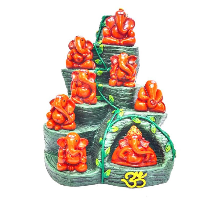 A multi-tiered resin sculpture of Hindu deity Ganesha, with each tier showing a Ganesha figure in a different pose, all in red color.