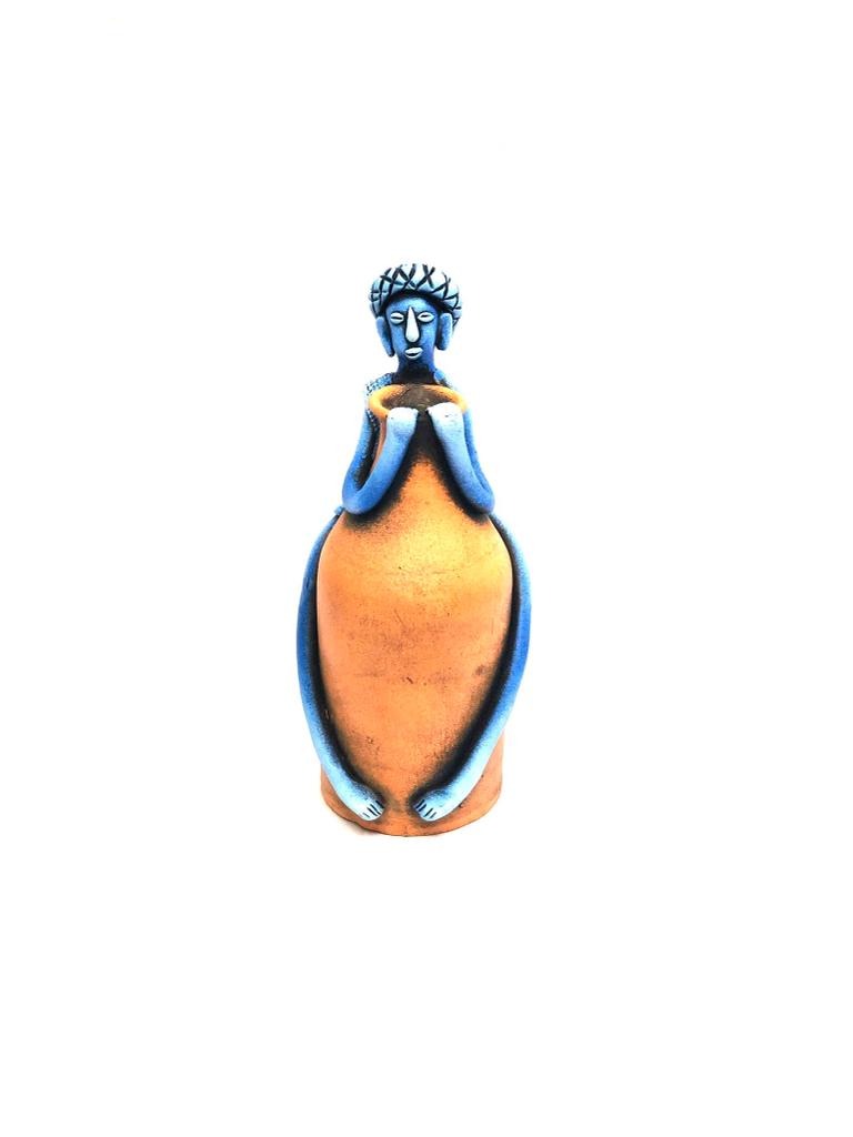 Tribal Man Sitting on Colorful Pot Exclusive Pottery Decoration By Tamrapatra - Tamrapatra