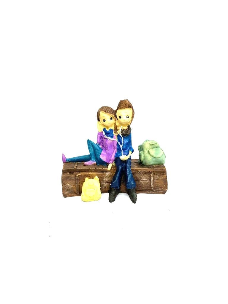 Young Couple Figure Sitting On Several Objects Gifting's Décor tarmapatra