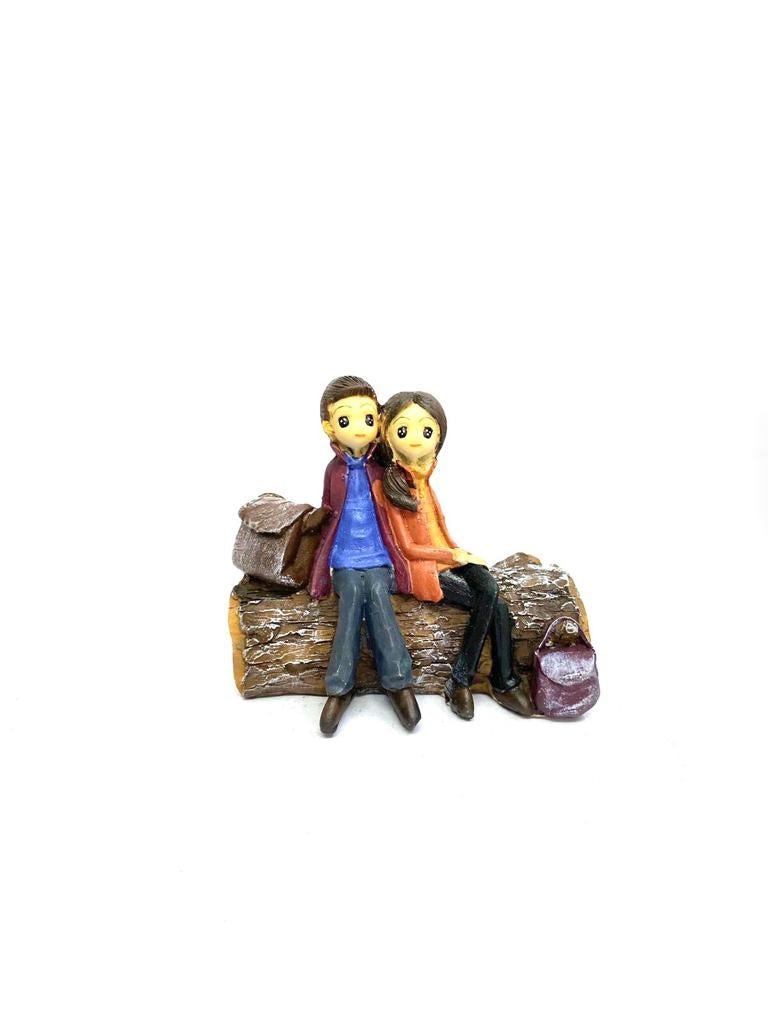 Young Couple Figure Sitting On Several Objects Gifting's Décor tarmapatra
