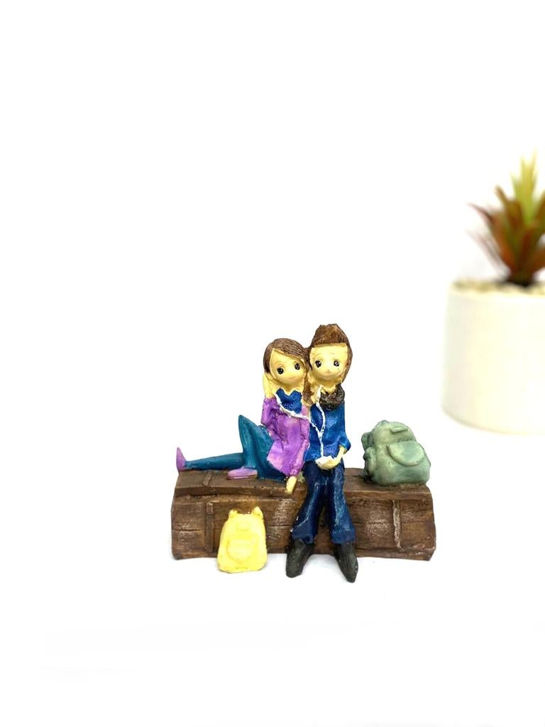 Young Couple Figure Sitting On Several Objects Gifting's Décor tarmapatra