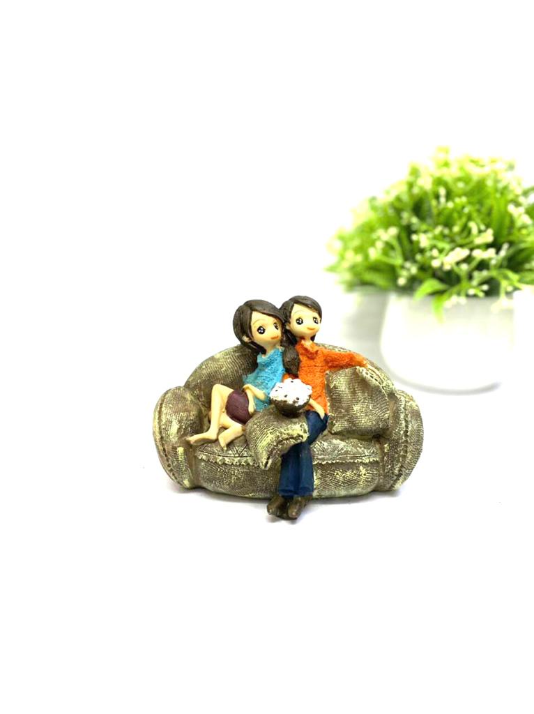Young Couple Figure Sitting On Several Objects Gifting's Décor tarmapatra