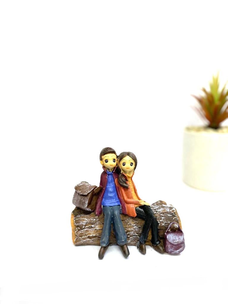 Young Couple Figure Sitting On Several Objects Gifting's Décor tarmapatra