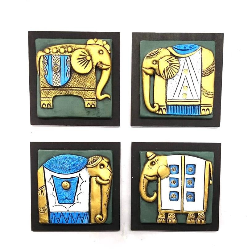 A set of four handcrafted terracotta pots with MDF bases, depicting elephant-themed designs in various colors.