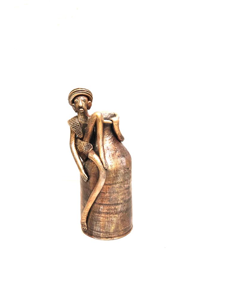 Tribal Man Sitting on Colorful Pot Exclusive Pottery Decoration By Tamrapatra - Tamrapatra