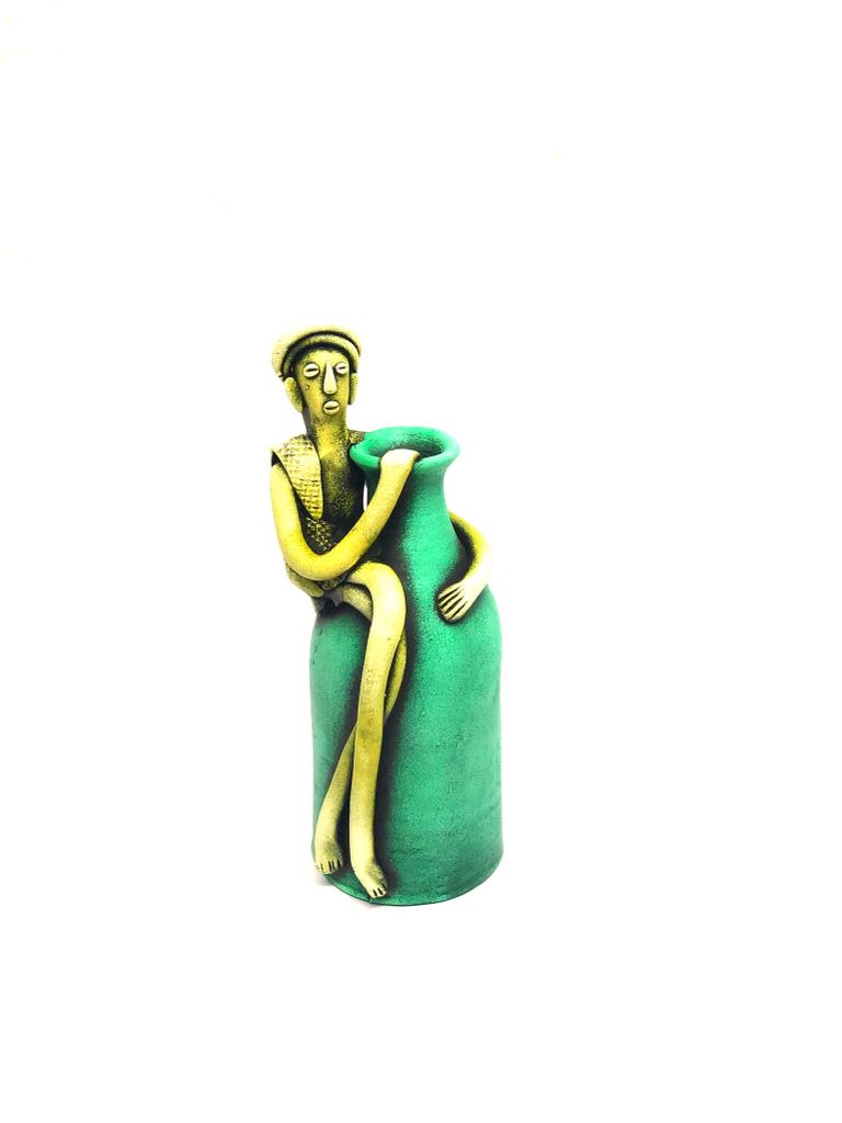 Tribal Man Sitting on Colorful Pot Exclusive Pottery Decoration By Tamrapatra - Tamrapatra