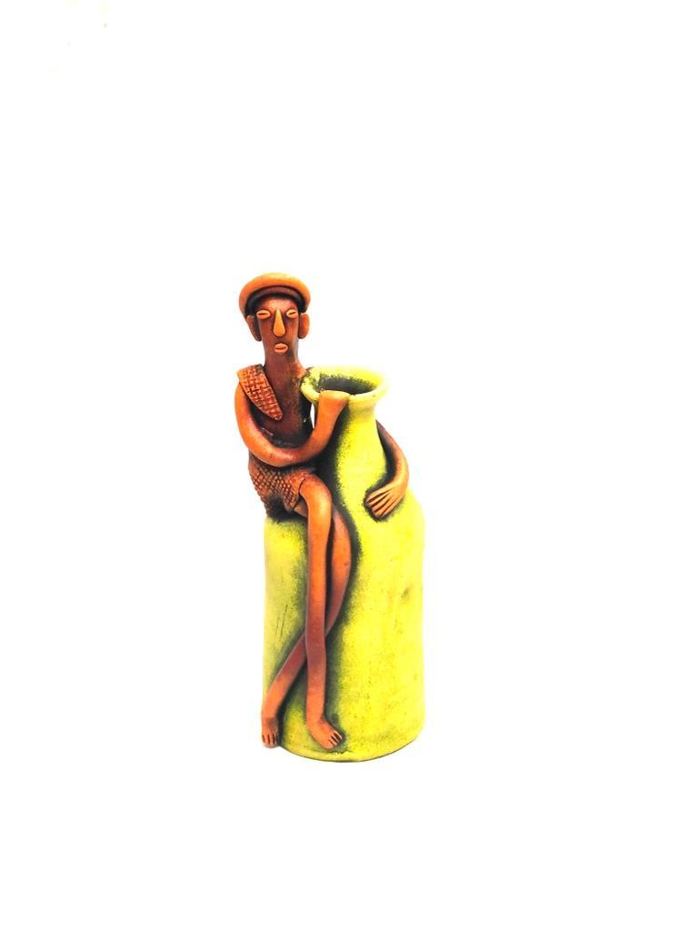 Tribal Man Sitting on Colorful Pot Exclusive Pottery Decoration By Tamrapatra - Tamrapatra