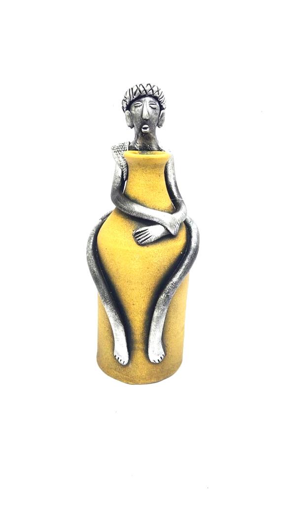 Tribal Man Sitting on Colorful Pot Exclusive Pottery Decoration By Tamrapatra - Tamrapatra