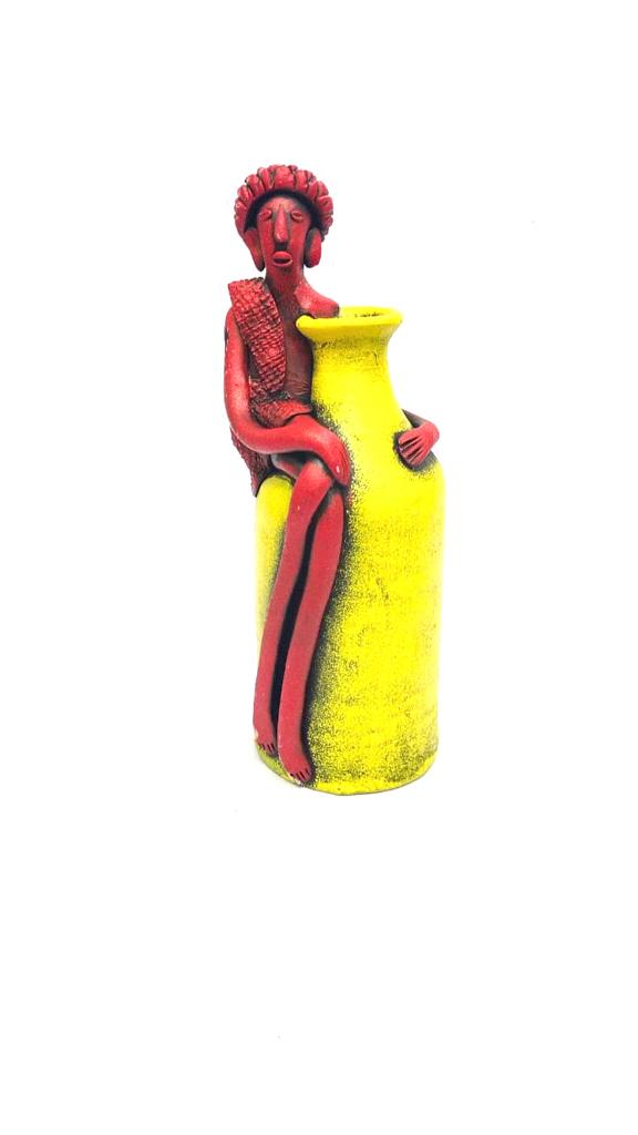 Tribal Man Sitting on Colorful Pot Exclusive Pottery Decoration By Tamrapatra - Tamrapatra