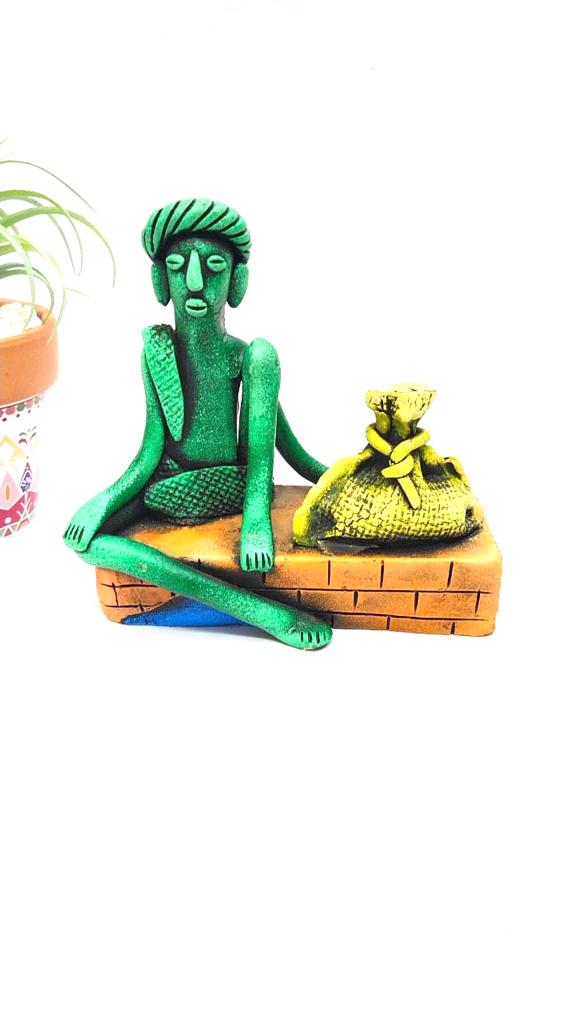 Man Sitting On A Brick Structure Best Collection Of Terracotta By Tamrapatra