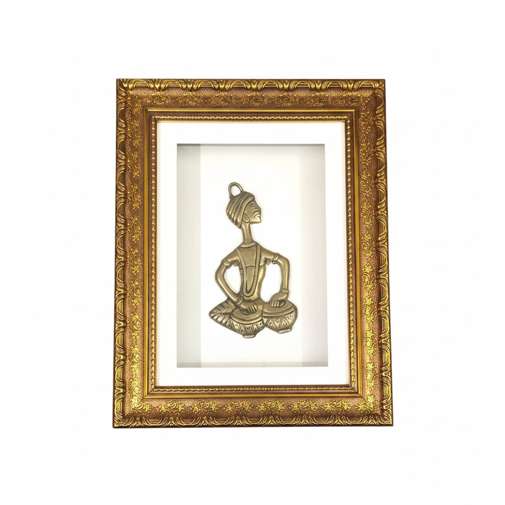 A brass sculpture of a musician with a golden frame, mounted on a wall.