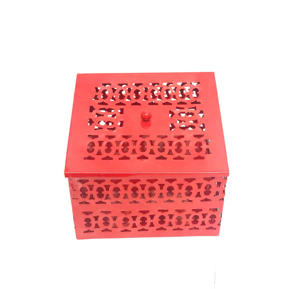A red square metal box with intricate carvings, likely handcrafted in India.