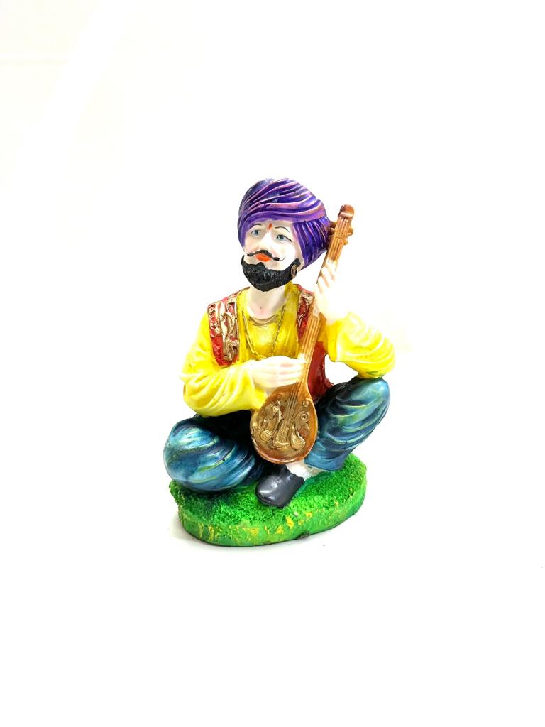Indian Rural Rajasthani Musician Playing Various Cultural Figurines By Tamrapatra