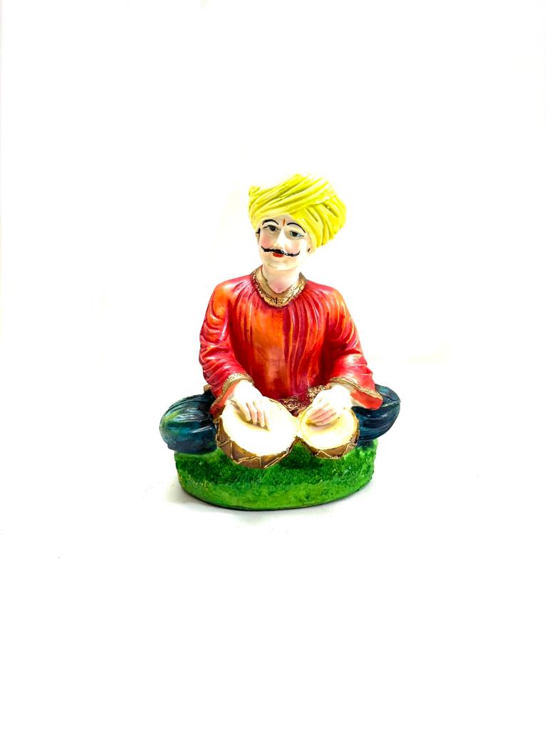 Indian Rural Rajasthani Musician Playing Various Cultural Figurines By Tamrapatra