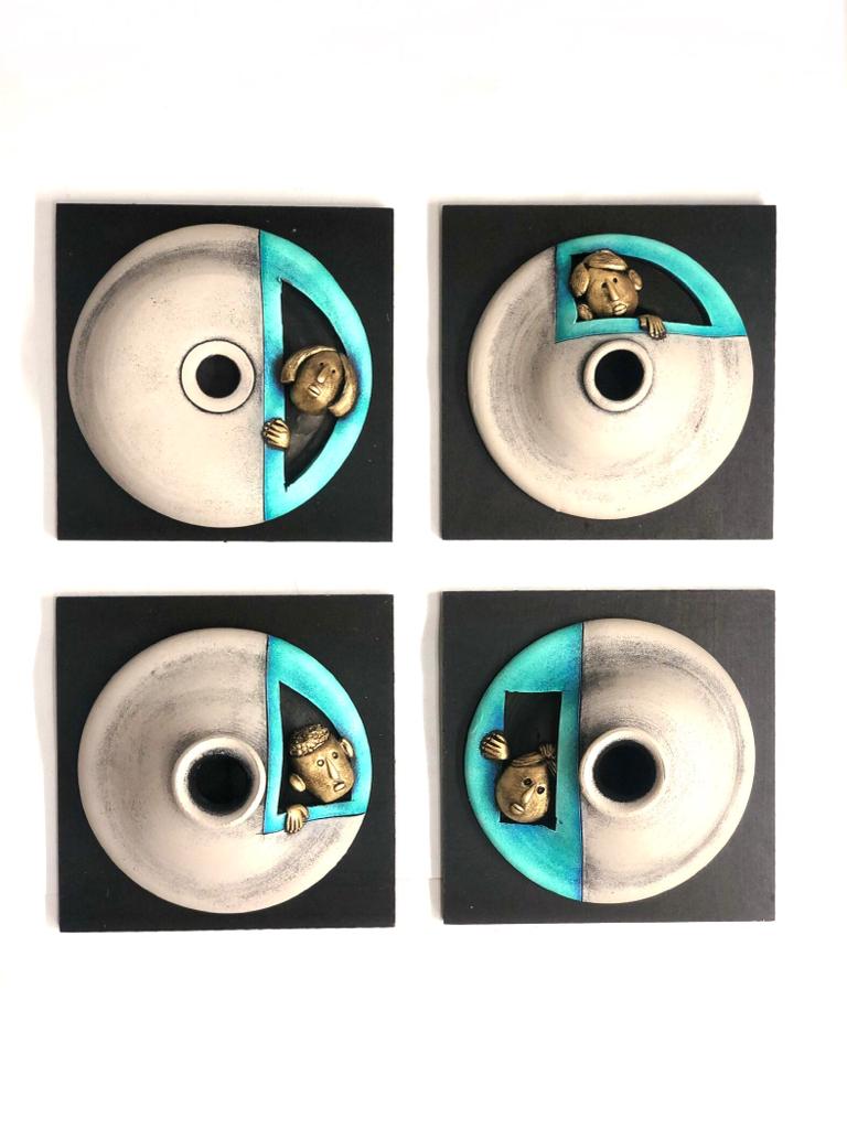 Grey With Turquoise Blue Texture On Creative Peeking Faces In Set Of 4 By Tamrapatra
