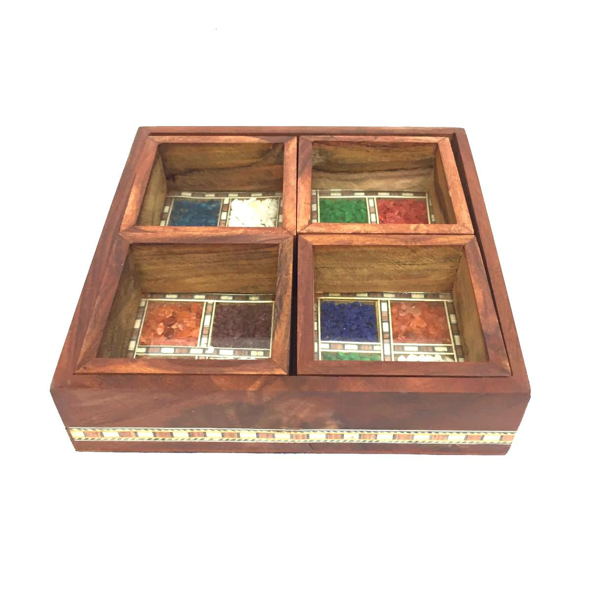A wooden platter tray with four compartments, each containing a different colored gemstone, set against a white background.