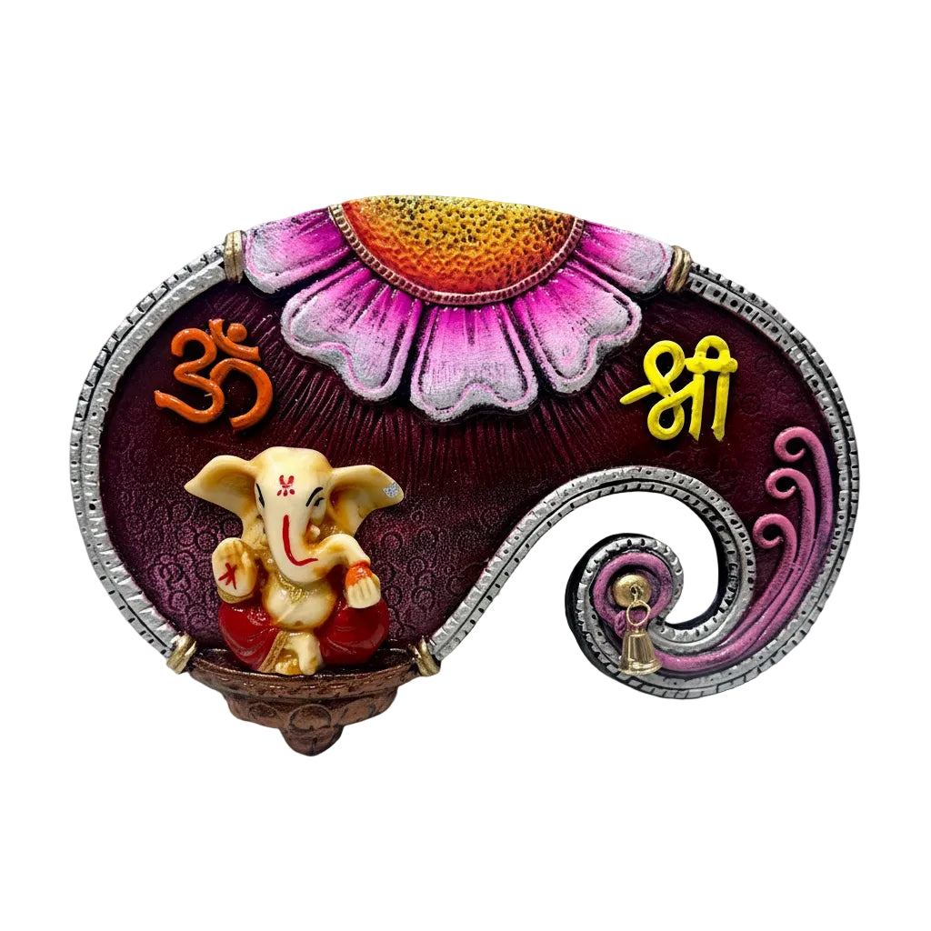 Decorative item with Ganesha figure, floral design, and symbols on a white background