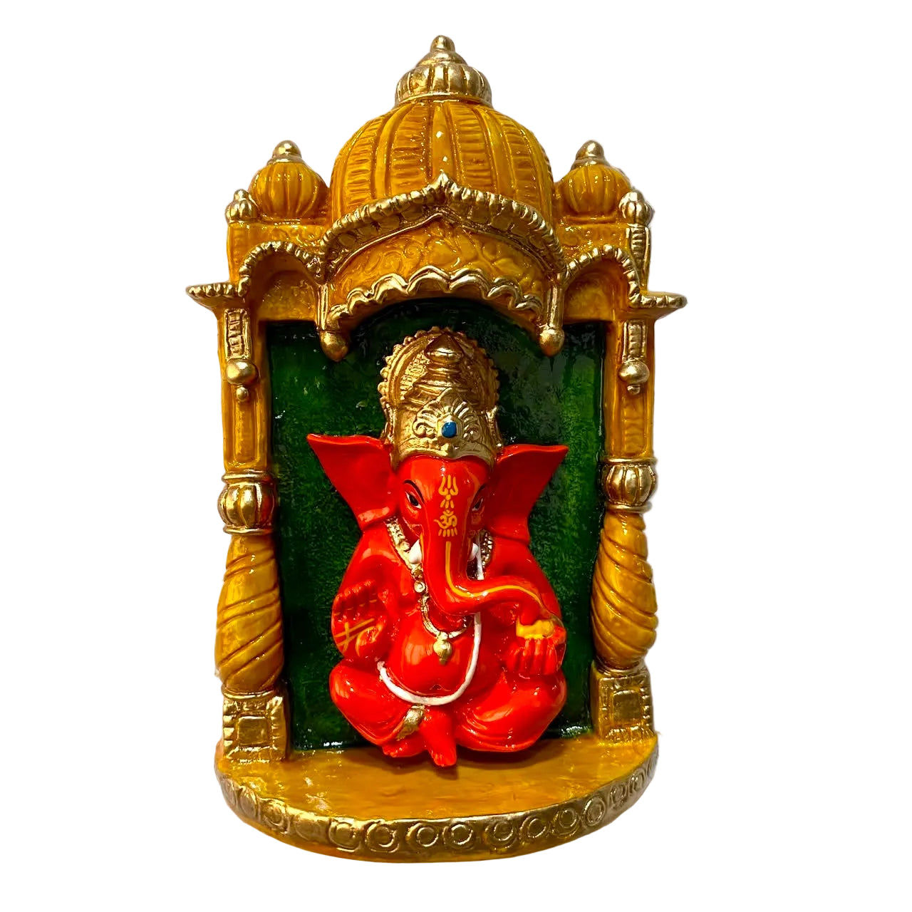 A decorative wall-mounted idol of Lord Ganesha, featuring a bright red Ganesha figure seated inside a gold-colored arched niche with a green back panel, mounted on a textured white wall.