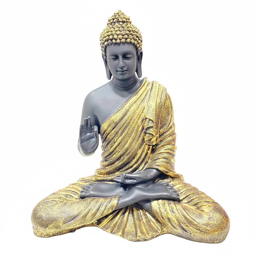 Statue of Buddha in meditation pose with gold and gray robes on a white background