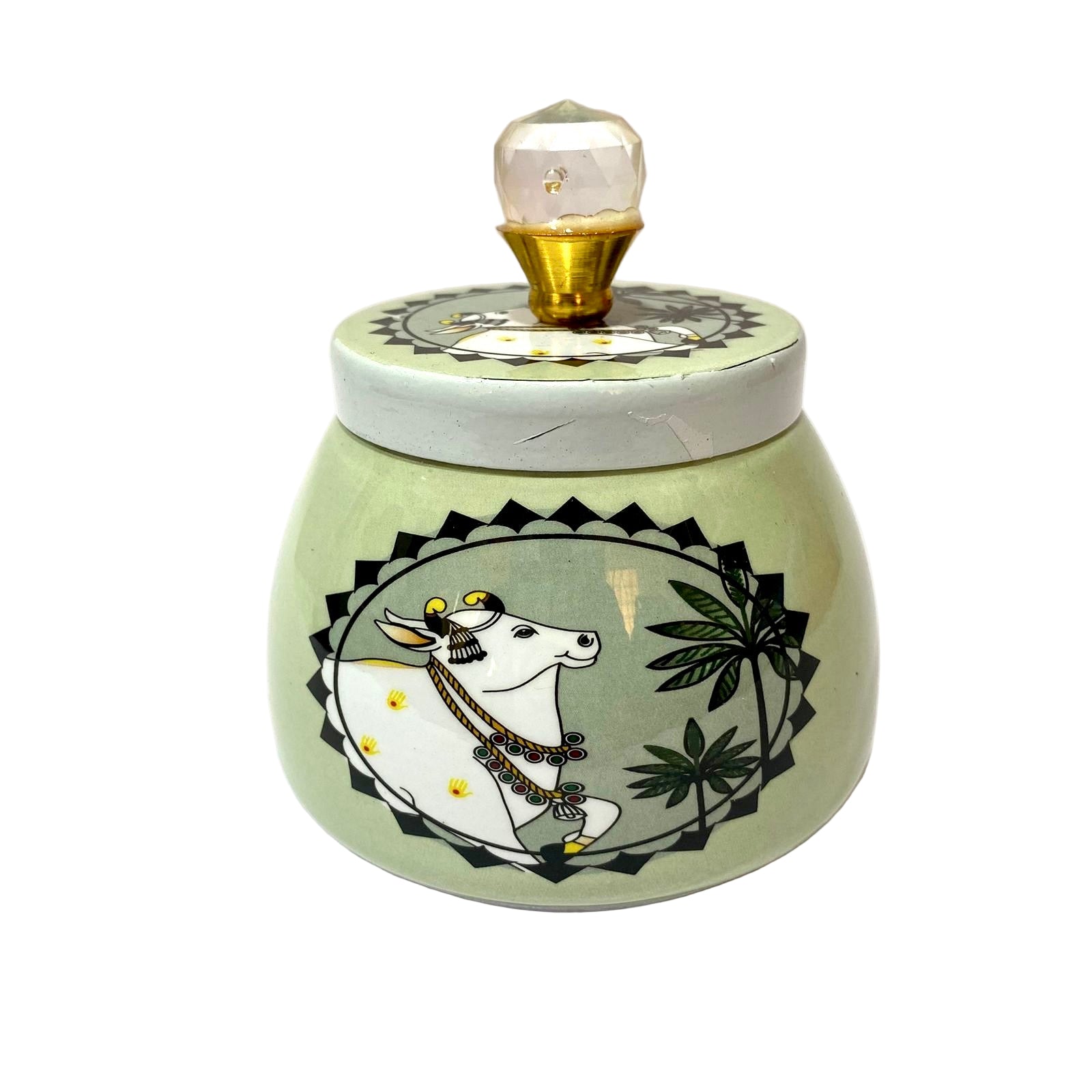 Decorative jar with cow illustration and light bulb on a white background