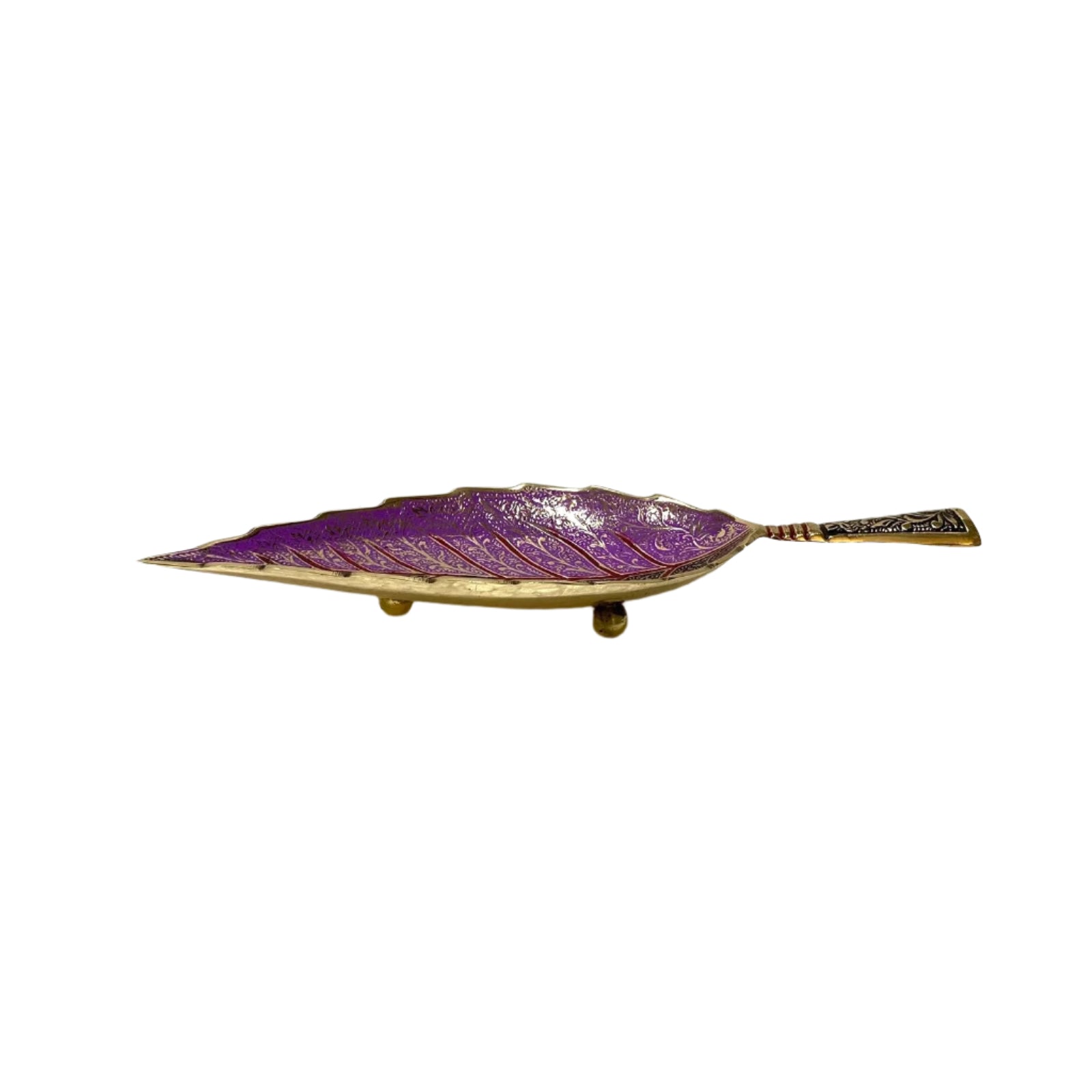 Purple leaf-shaped dish on a white surface with a light gray background
