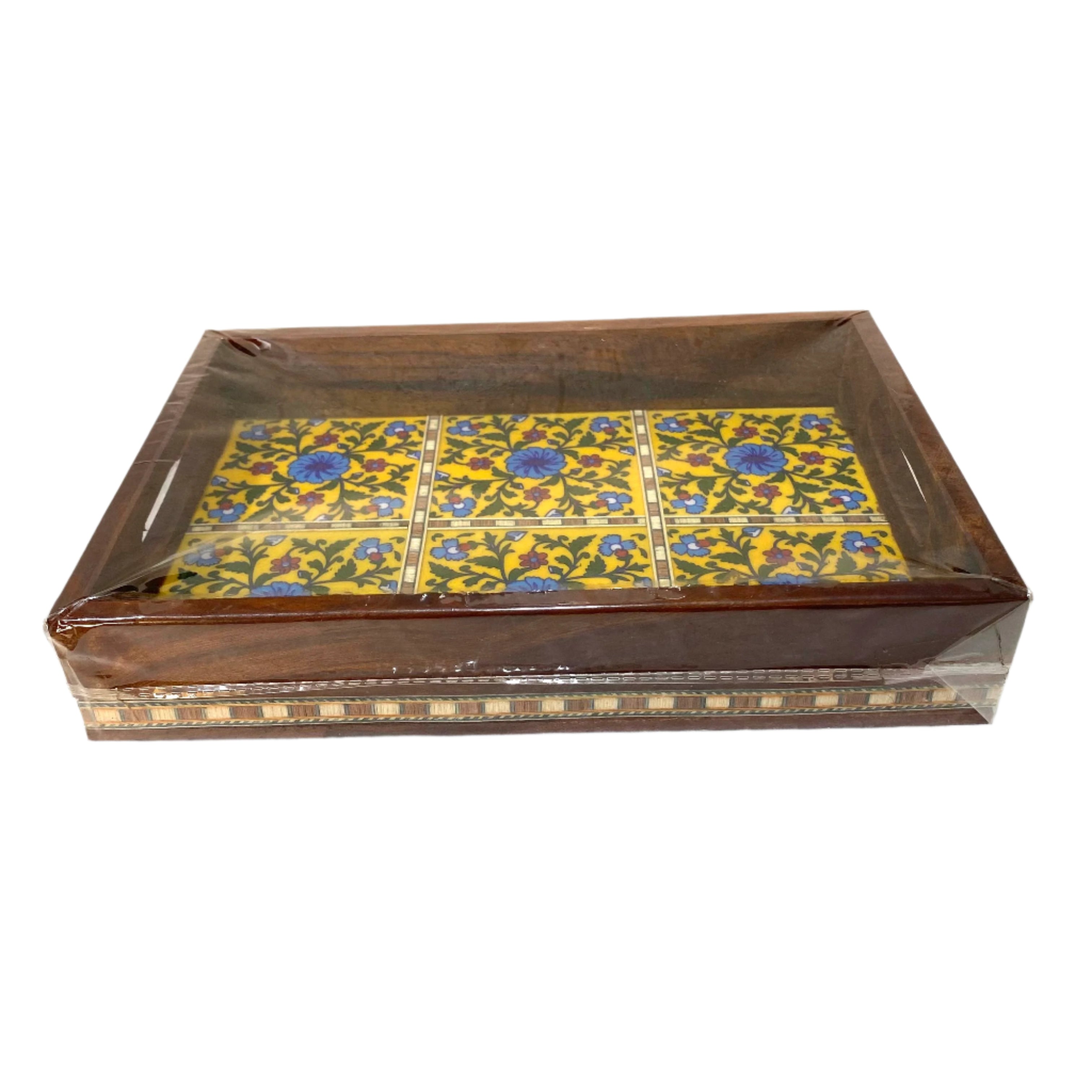 Decorative wooden box with floral pattern on a white surface